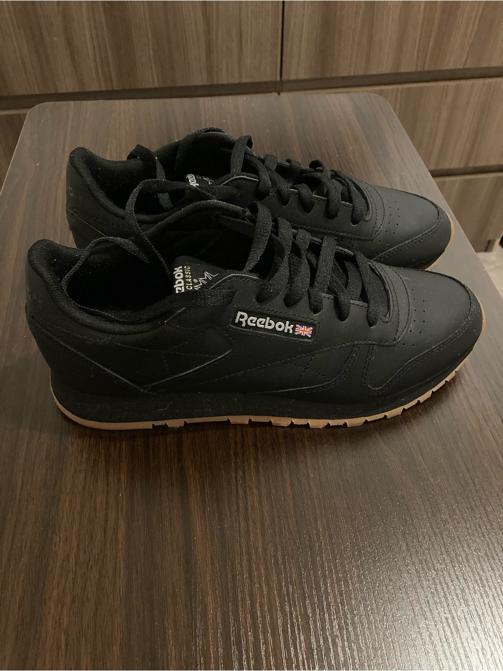 Reebok Women’s Classic Leather Sneakers in Black with Gum Sole